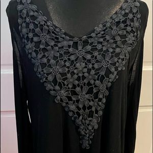 Cold shoulder long sleeve shirt.